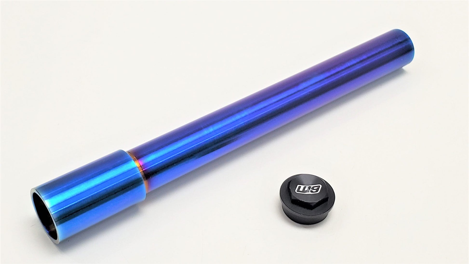 Warp9Racing titanium front wheel axle for bicycles, shown from the left side, lightweight and durable for enhanced performance.
