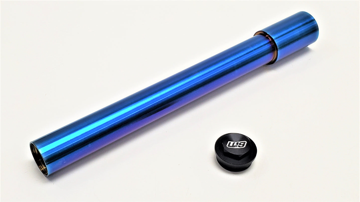 Warp9Racing titanium front axle for KTM motorcycles, showing the right side with sleek metal construction and precise machining.