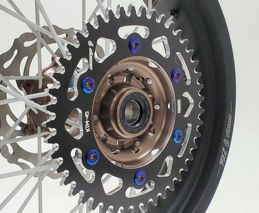 Warp9Racing titanium sprocket bolt kit with multiple bolts, designed for lightweight, durable motorcycle hardware installation.