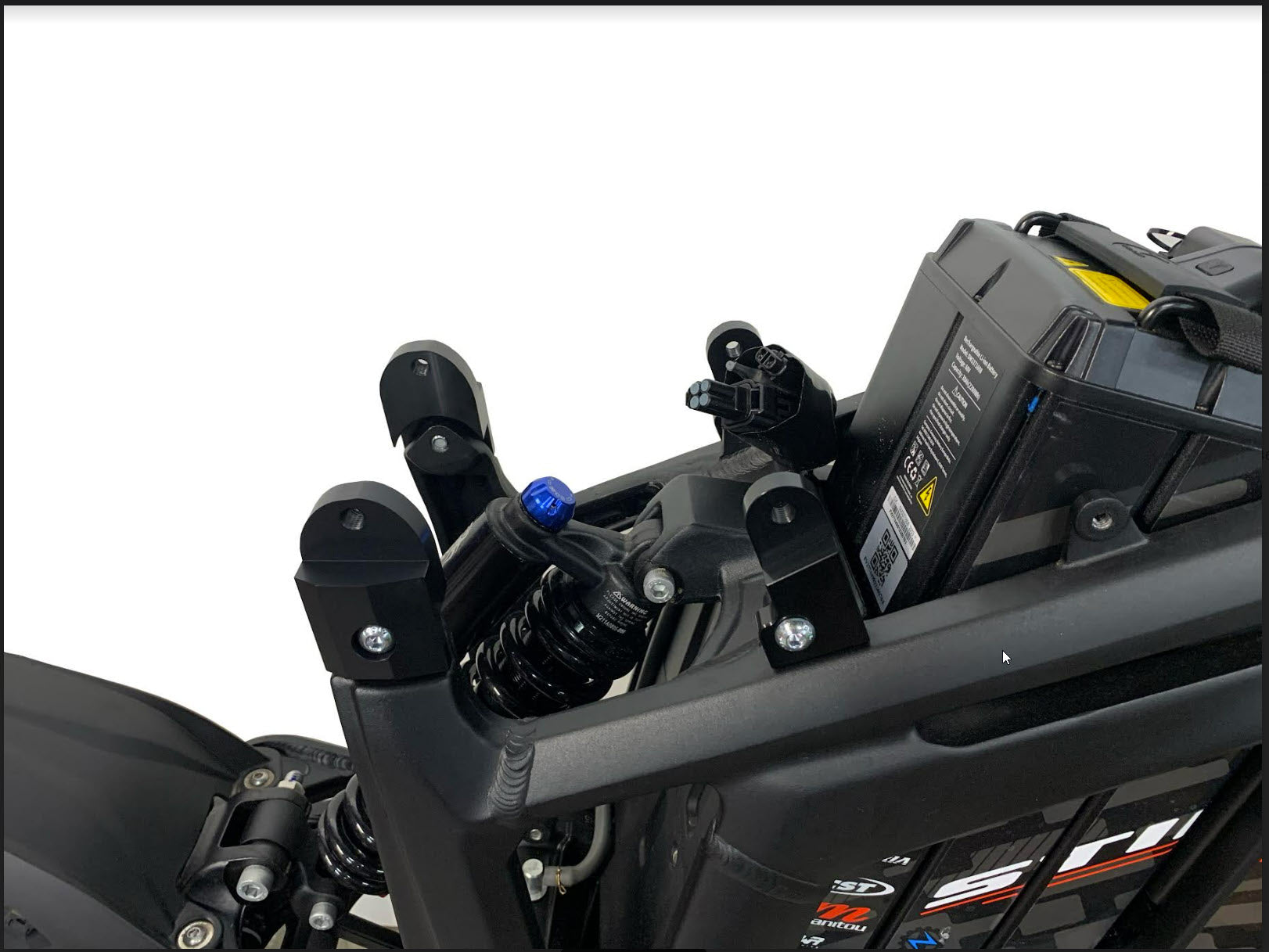 eDirtyBike Talaria Sting MX3/MX4 seat riser kit installed on frame for improved rider comfort and seat height adjustment.