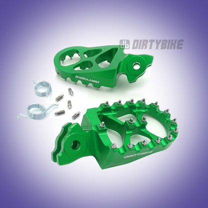 Green CNC aluminum foot pegs for Talaria MX and X3 eRide Pro electric bikes, designed for durability and rider comfort.