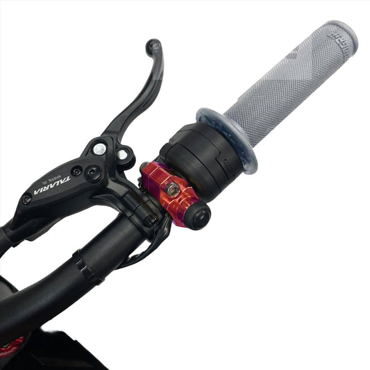 Red 1/4 turn electronic throttle kit for Talaria Sting MX3 electric bike by eDirtyBike, featuring start button and throttle components.