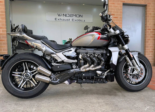 Triumph Rocket 3R & GT stainless steel exhaust manifold by Bill's Exhausts, showing polished headers and exhaust components.