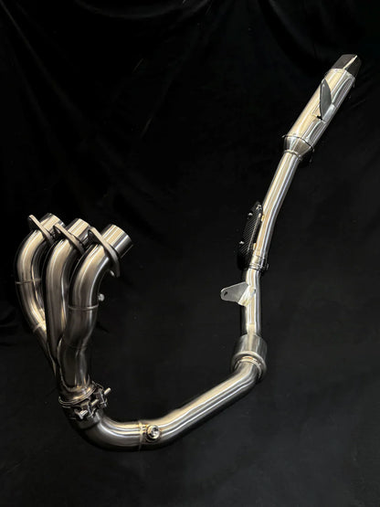 Stainless steel Triumph Tiger 850-900 full exhaust system by Bill's Exhausts, shown installed on a motorcycle.