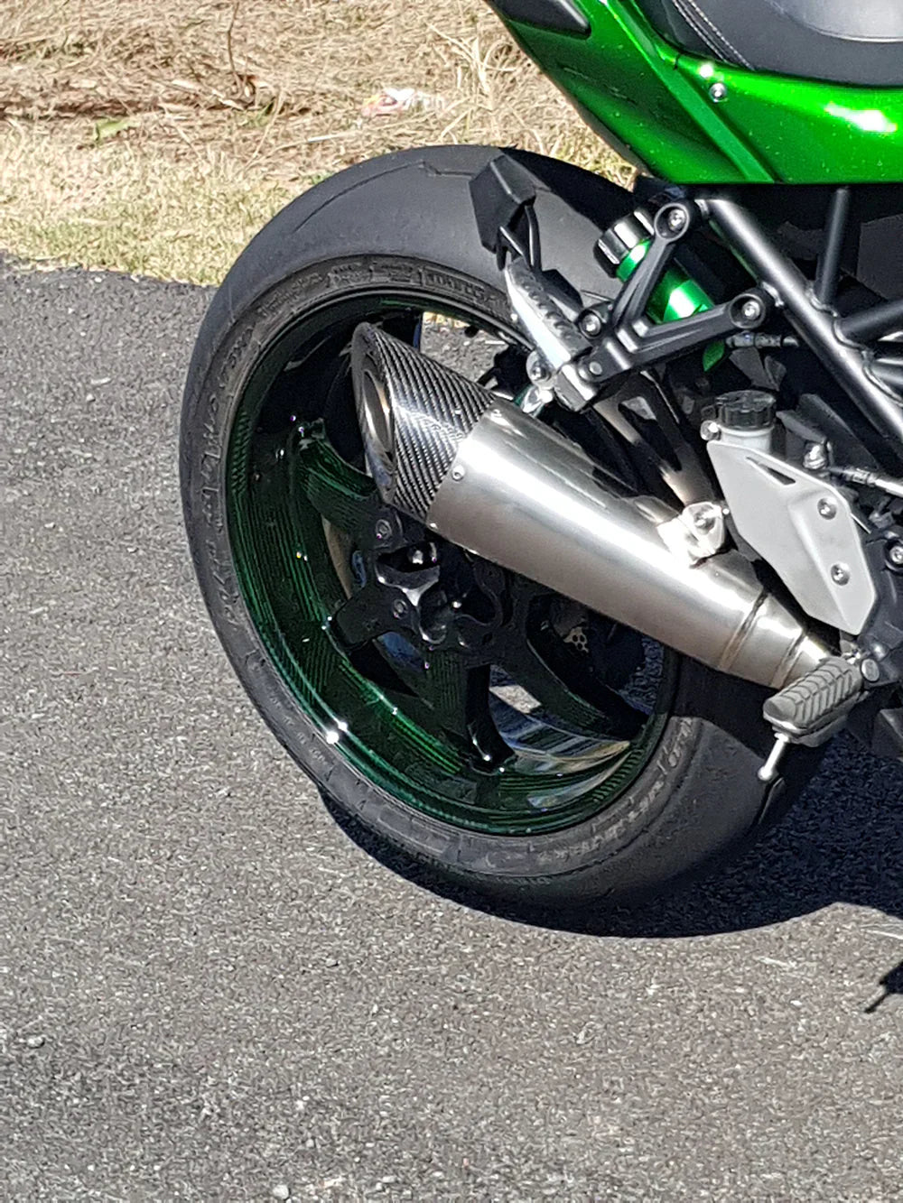 Vandemon titanium carbon tip slip-on exhaust for Honda H2 SE SX 2018-24 motorcycle, showing sleek metallic finish and branding