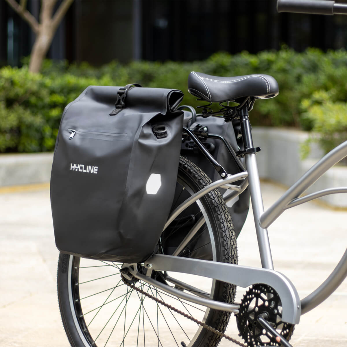 Waterproof Hycline bike pannier bag attached to bicycle rack, durable fabric with reflective strips for visibility.