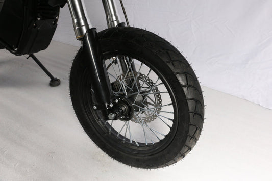 Electro & Co ETM RTR 14-inch street wheel set with tires, rotors, and chain, mounted on a bicycle.