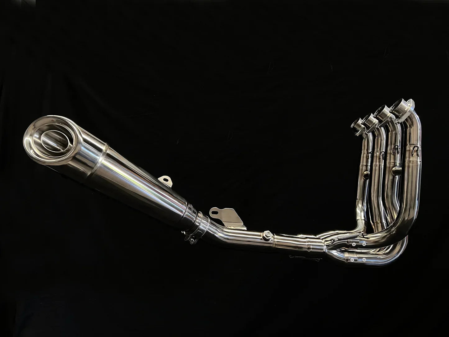 Polished titanium exhaust system for Kawasaki Ninja ZH2 2020-2025, open box, by Bill's Exhausts, showcasing sleek metallic finish.