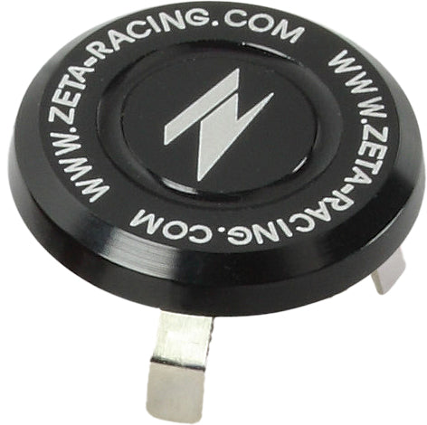 Black ZETA aluminum stem cap for dirt, supermoto, and dual sport bikes, ZE58-4131 model, shown on a motorcycle handlebar.