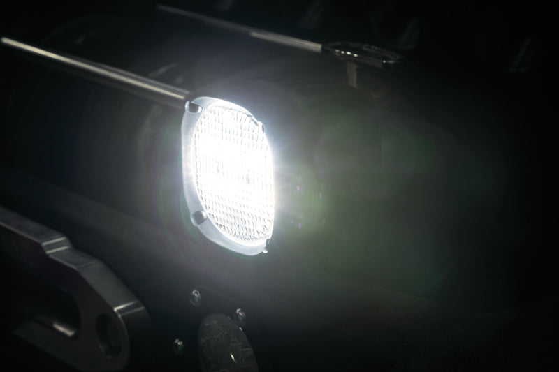 Kuryakyn Lodestar 1850L high-output driving lights for powersports vehicles, shown mounted on a motorcycle.