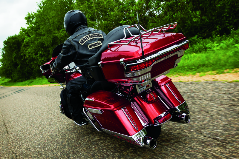 Kuryakyn Relocator for Tour-Pak 14-Up Touring Models in black, showing the adjustable mounting bracket and hardware.