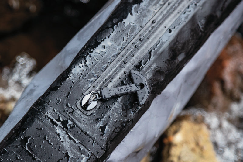 Kuryakyn Torke Dry Rifle Case, waterproof and submersible, designed for hunting and range protection, shown with rifle inside.
