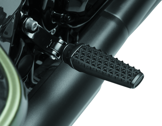 Black Kuryakyn Thresher Pegs with Adapter for Harley-Davidson motorcycles, shown mounted on motorcycle footpeg brackets.