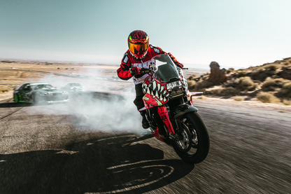 Red ICON Airform™ helmet in medium size, featuring a sleek design and adjustable straps, for motorcycle riding.