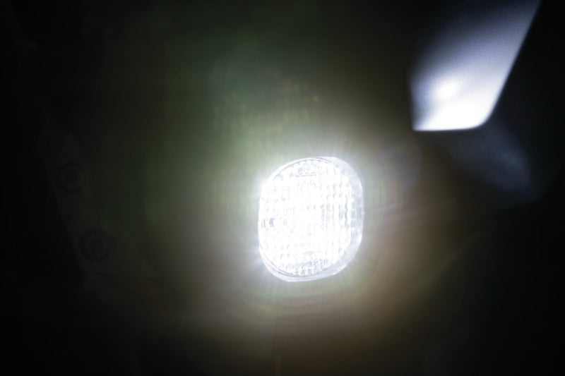 Kuryakyn Lodestar 750L flood beam high-output driving lights mounted on a powersports vehicle for enhanced visibility