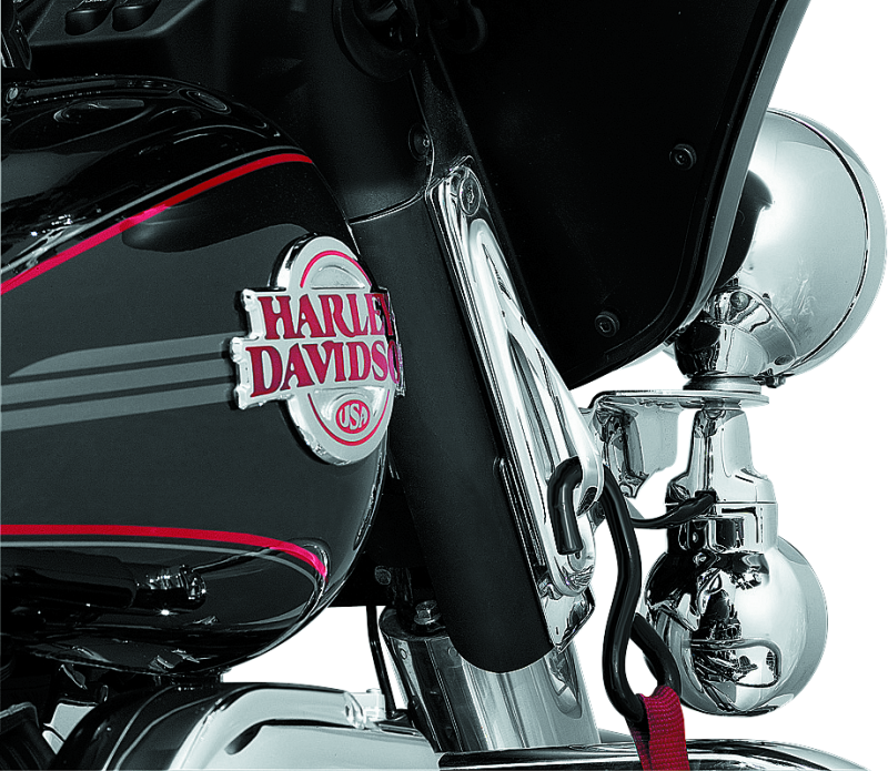 Kuryakyn custom teardrop tie-down brackets in chrome for Harley Davidson Road King touring models, designed for secure motorcycle strap attachment.
