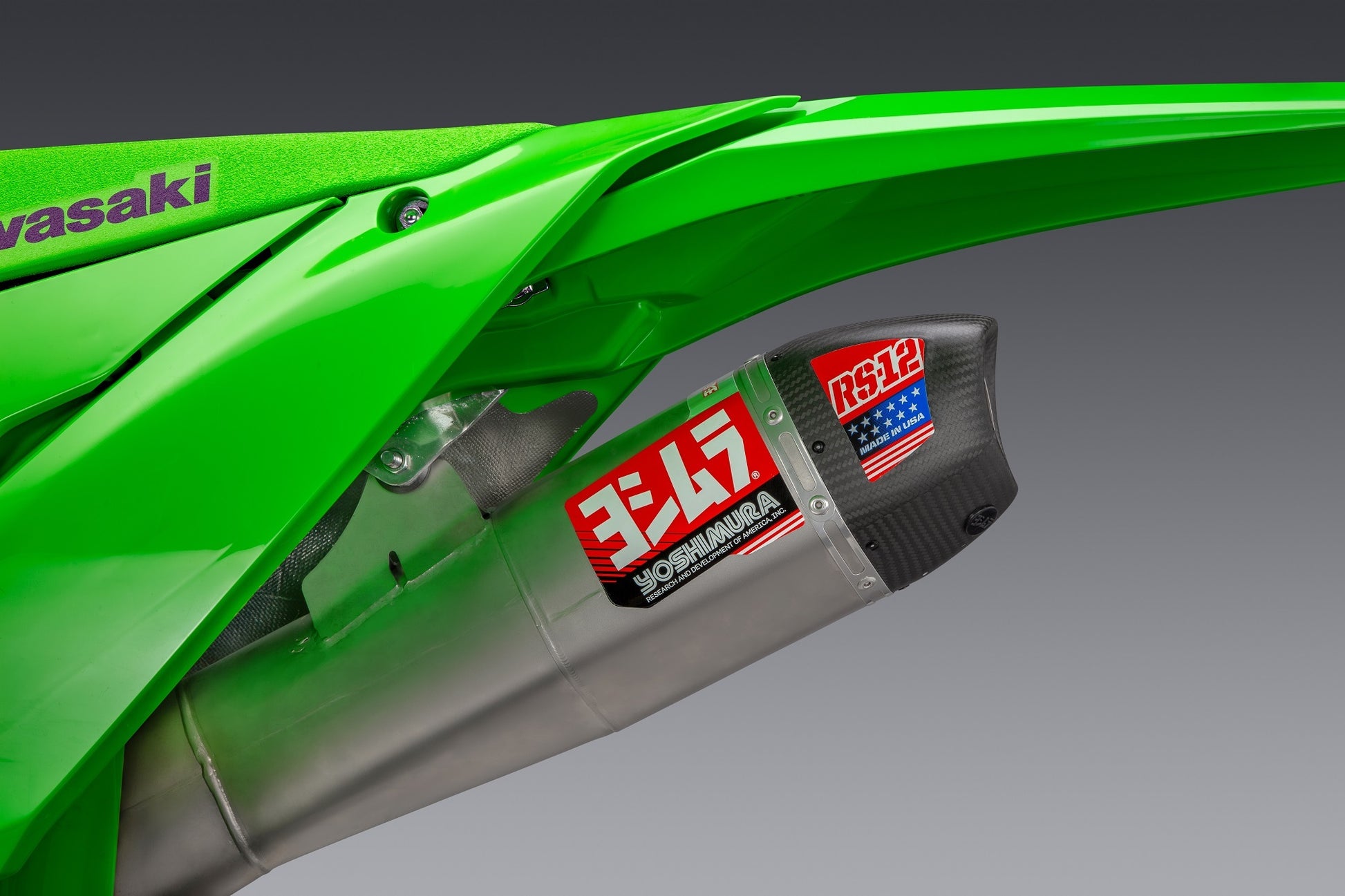 Yoshimura RS-12 motorcycle exhaust system for Kawasaki KX450 with stainless steel, aluminum, and carbon fiber components.