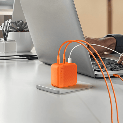 Jackery 102W GaN 3-Port Fast Charger with compact black design and three charging ports
