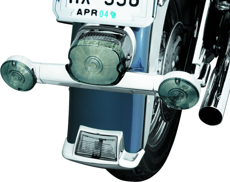 Chrome Kuryakyn Narrow Turn Signal Bar for Harley Davidson motorcycles, part #2384, mounted on bike with detailed chrome finish.