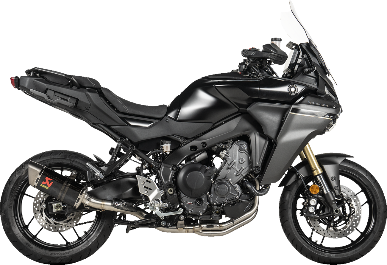 AKRAPOVIC Racing Line exhaust system with carbon fiber finish for Yamaha Tracer 9 motorcycle, featuring sleek design and performance parts.