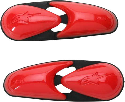 Alpinestars flexible red toe sliders for motorcycle boots, designed for added protection and style during riding.