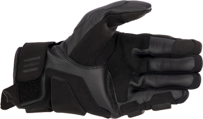 Alpinestars Phenom gloves in black and white, 2XL size, showing padded racing gloves with adjustable wrist strap.