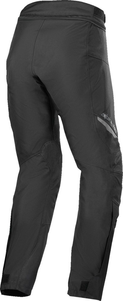 Alpinestars ST-1 Waterproof Pants in black, 4XL size, showing durable waterproof fabric and adjustable waist for motorcycle riding.