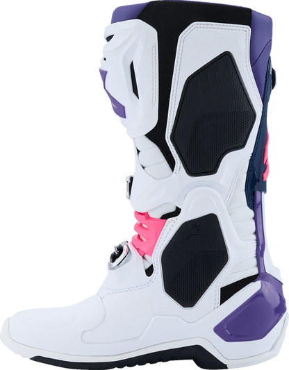 Alpinestars Tech 10 motocross boots in white, violet, navy, and pink fluorescent with black accents and ankle protection.