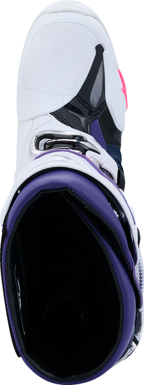Alpinestars Tech 10 motocross boots in white, violet, navy, and pink fluorescent with adjustable straps and reinforced soles.