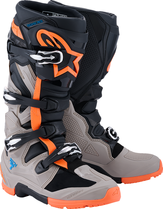 Alpinestars Tech 7 Enduro Boots in black, warm gray, and fluorescent orange with sturdy design and ankle protection.