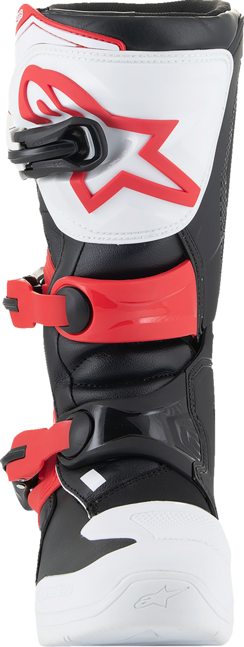 Alpinestars Youth Tech3S motocross boots in white, black, and red for junior riders, showing the protective design and branding.