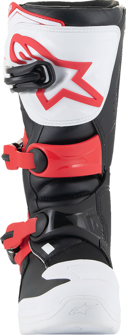 Alpinestars Youth Tech3S motocross boots in white, black, and red for junior riders, showing the protective design and branding.