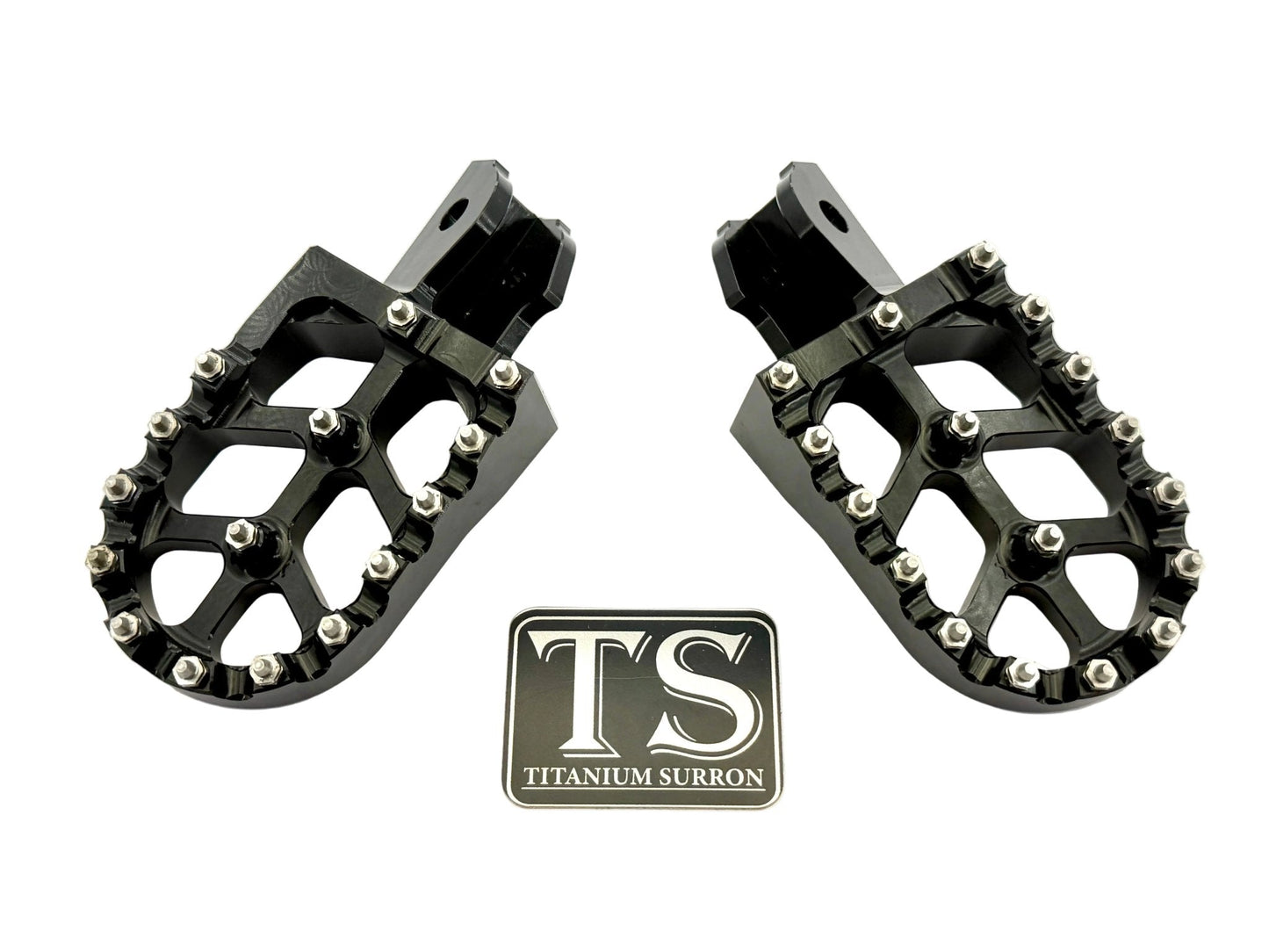 Anodized aluminum 6061 TS foot pegs for Surron e-moto and similar electric bikes, featuring durable titanium Surron branding.