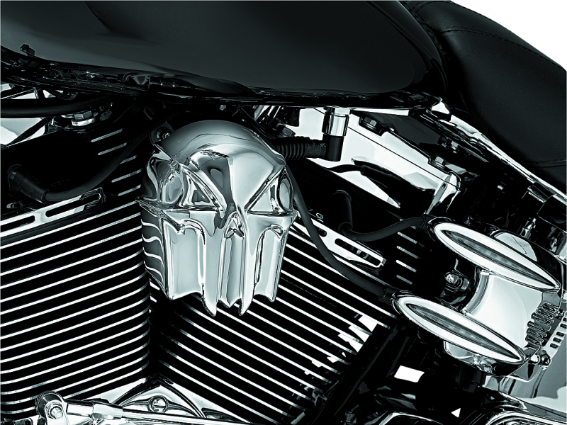 Chrome skull horn cover by Kuryakyn for Harley-Davidson motorcycles, part #7718, featuring a detailed skull design.