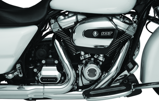 Kuryakyn Milwaukee-8 Chrome Starter Cover for Harley-Davidson motorcycle engine, shiny chrome finish, detailed design.