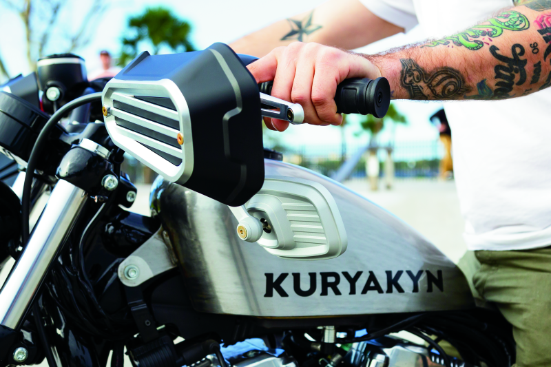 Kuryakyn Dillinger motorcycle grips with dual cables in satin black, featuring a sleek, textured design for cruiser bikes.