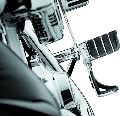 Chrome Kuryakyn Switchblade Pegs with male mount adapter for Harley and metric motorcycles, showing the sleek footrest design.
