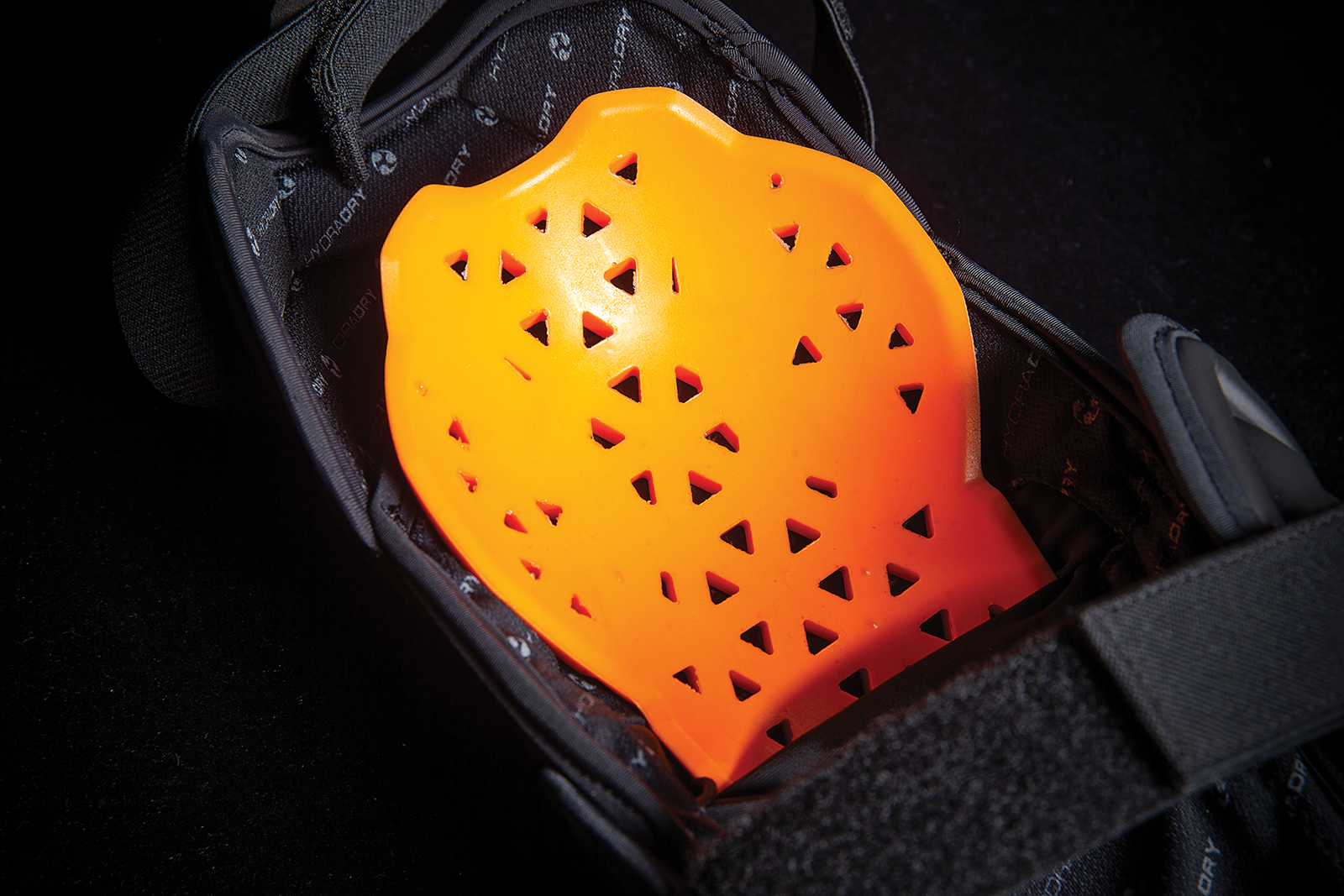 Black ICON Field Armor 3™ knee armor from Bill's Exhausts, designed for L/XL size with durable protective features.