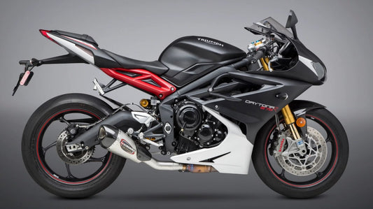YOSHIMURA Alpha T Street exhaust slip-on with stainless steel and carbon fiber end cap, designed for motorcycle performance.