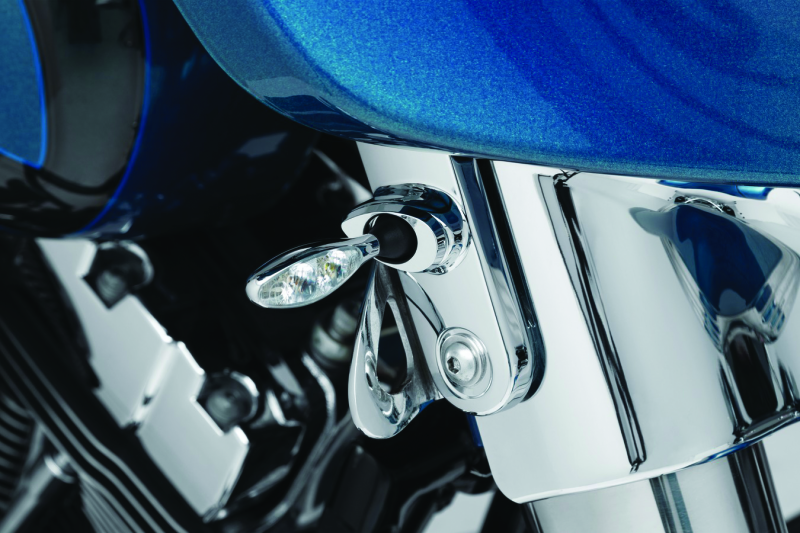 Kuryakyn Kellermann front turn signal mounts in chrome for Harley Davidson FLHX models, shown installed on motorcycle handlebars.