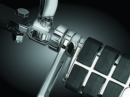 Chrome Kuryakyn 1-1/4 inch stirrup heel rest extenders for Harley-Davidson motorcycle footpegs.