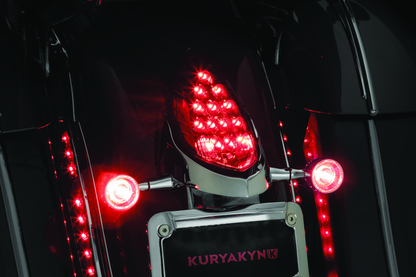 Kuryakyn custom rear turn signal and license plate mount for Indian motorcycles, shown on a black motorcycle with clear signals