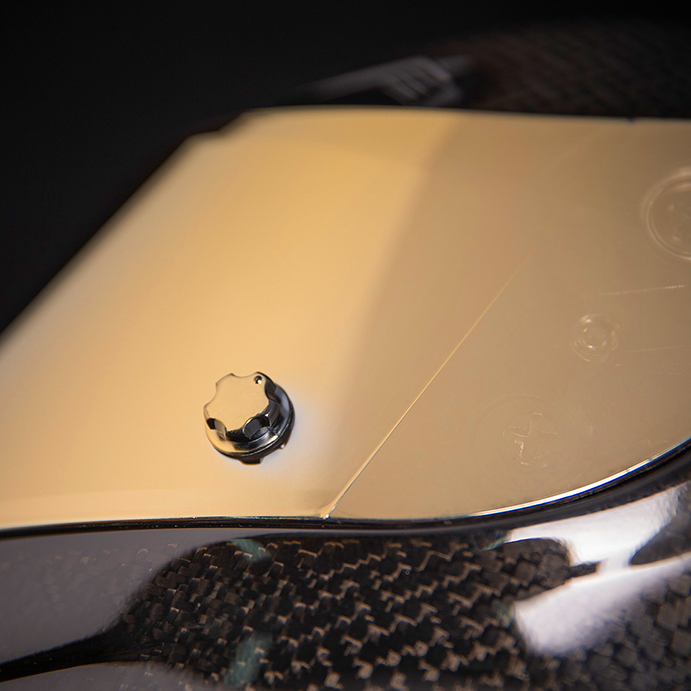 ICON Airframe Pro™ helmet in carbon with gold detailing, small size, featuring a sleek aerodynamic design and ventilation.