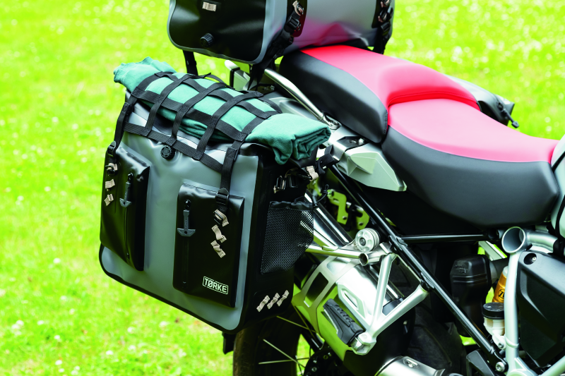 Kuryakyn Torke 24L waterproof dry bag panniers for power sports, showing the durable, secure storage solution for motorcycles.
