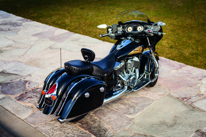 Kuryakyn LED curved license plate frame for Indian motorcycles with chrome finish, showcasing its sleek, illuminated design.