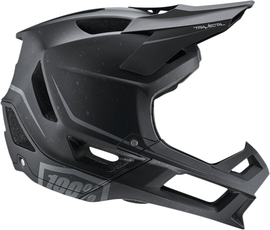 Black 100% Trajecta bicycle helmet with Fidlock buckle in medium size, featuring a sleek design and adjustable straps.