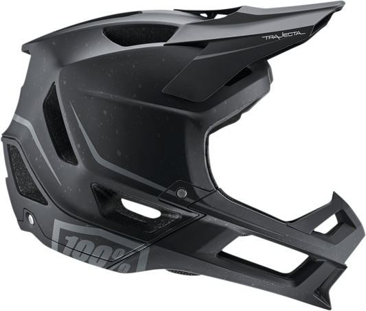 Black 100% Trajecta bicycle helmet with Fidlock buckle in medium size, featuring a sleek design and adjustable straps.