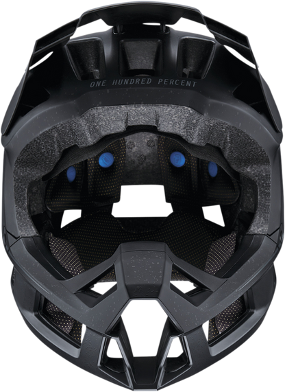 Black 100% Trajecta bicycle helmet with Fidlock buckle, medium size, designed for safe and comfortable cycling.