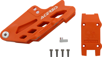 Orange Acerbis complete chain guide block for KTM, Gas Gas, Husqvarna, and Sherco bikes, shown on a motorcycle body.