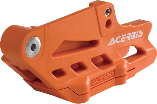 Orange Acerbis complete chain guide block for KTM, Gas Gas, Husqvarna, and Sherco bikes, mounted on motorcycle frame.